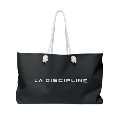 La Discipline Weekender Bag — Black Travel Tote with Minimalist Logo Printify
