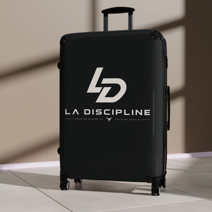 La Discipline Logo Carry-On Suitcase – Black Hard-Shell Travel Luggage Printify