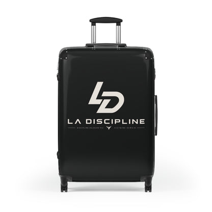 La Discipline Logo Carry-On Suitcase – Black Hard-Shell Travel Luggage Printify